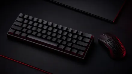 An unbranded ultralight gaming mouse beside a compact mechanical keyboard